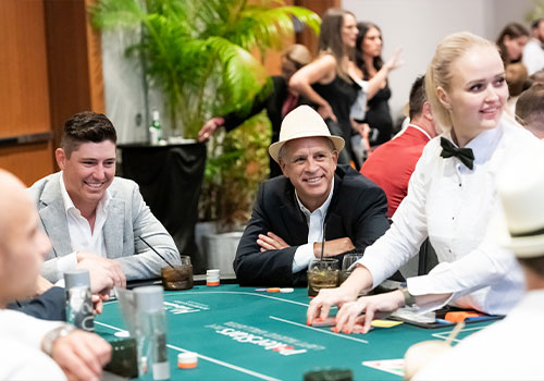 Robert Julien and others playing poker at Havana Nights Charity