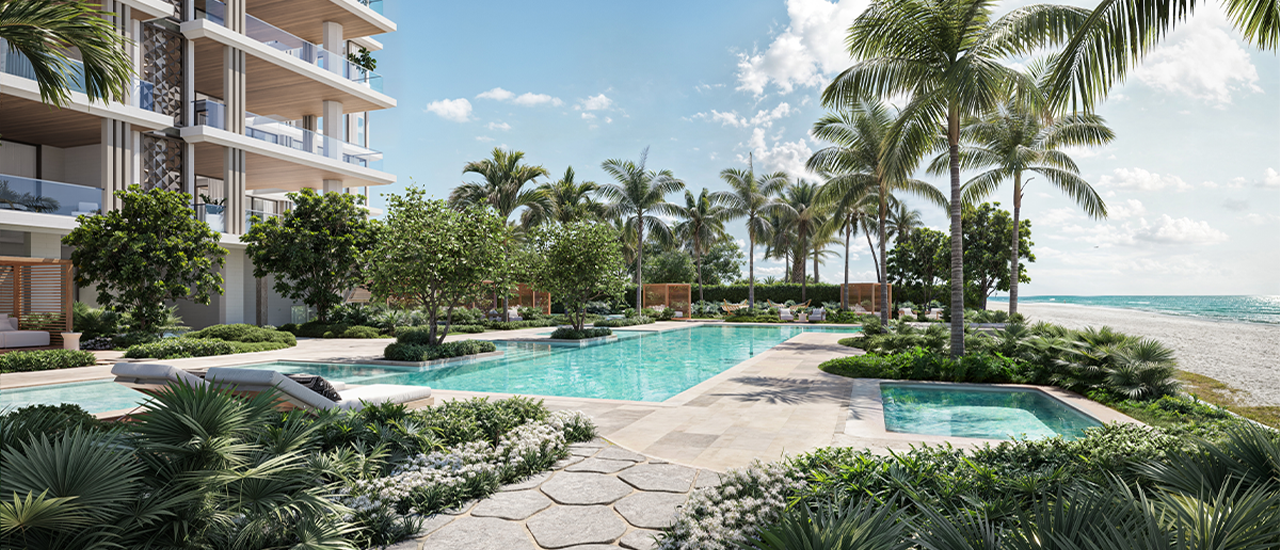 Beachfront residential pool with palm trees, landscaped gardens, lounge chairs, and modern condominium balconies beside the ocean.