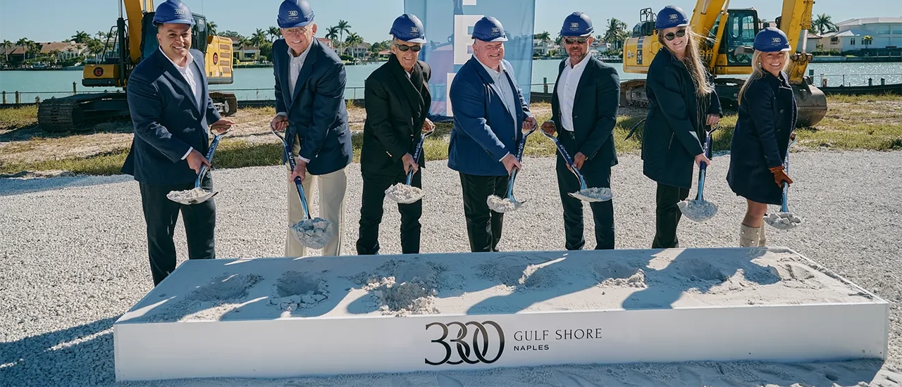 People with shovels at construction groundbreaking ceremony